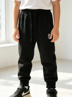 Urchin Pantaloni tuta da bambino con coulisse e polsini - nero